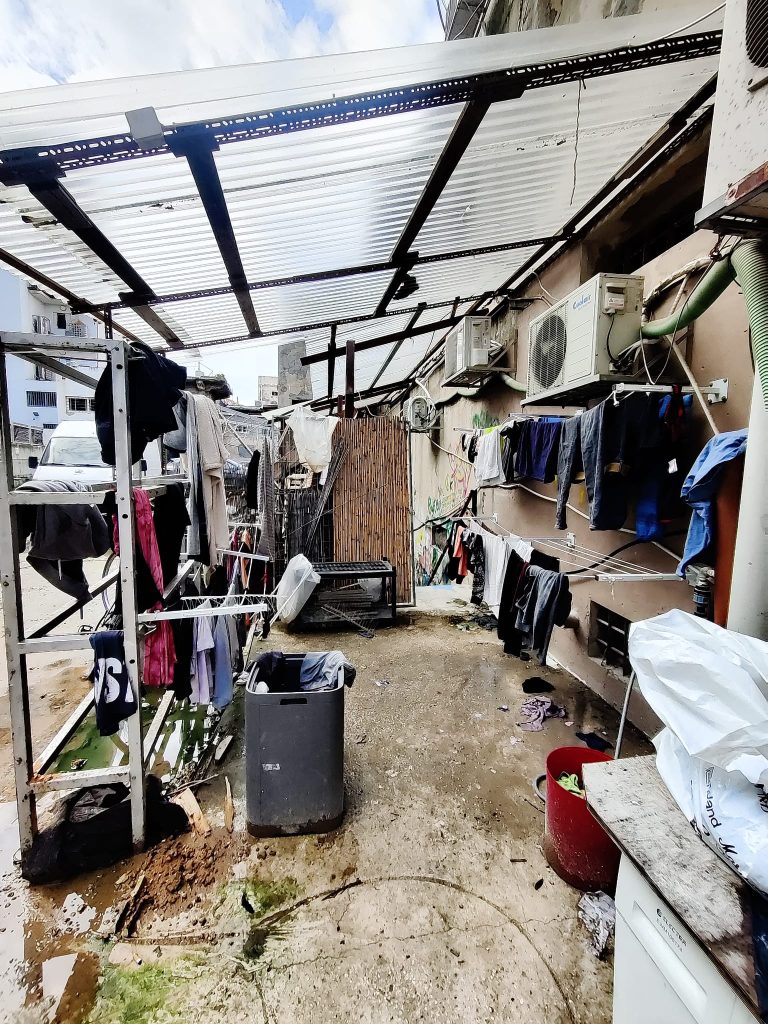 Drying area for clothes with muddy floor and a plastic roof